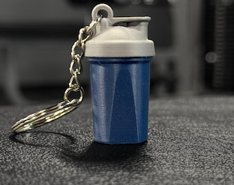Llavero mezclador de proteínas - HACE RUIDO / Mini botella mezcladora antiestrés impresa en 3D con tapa extraíble, regalo perfecto para los amantes del gimnasio y el fitness.
