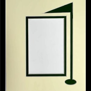May include: A white picture frame with a green and black mat. The mat has a golf flag design with a green flag and a black pole.