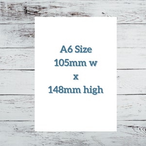 May include: A white card with the text "A6 Size 105mm w x 148mm high" printed in blue.