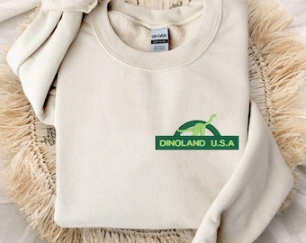 Pull à col rond unisexe brodé Dinoland USA | Voyage Walt Disney World | Règne animal | Orlando, Floride