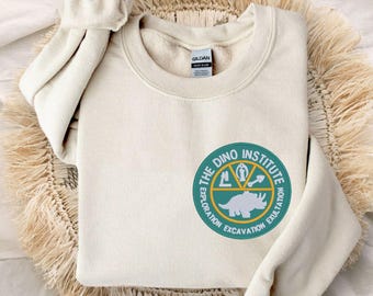 Pull à col rond unisexe avec logo Dino Institute brodé | Voyage Walt Disney World | Règne animal | Orlando, Floride