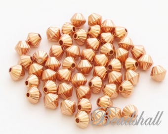 10 Perlen Bicones DQ Metallperlen rosegoldfarben