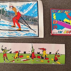 May include: Three vintage ski and snowboard patches. One patch depicts a skier in red and orange attire on a snowy slope. Another patch shows a snowboarder with the text "Skating Sky Fun...in Snowboard". The third patch shows snowboarders.