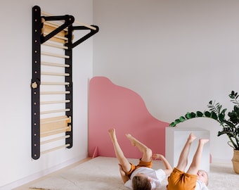 May include: Two children are playing on a white carpet in a room with a pink wall and a black and wood wall-mounted climbing ladder. A potted plant is in the corner of the room.