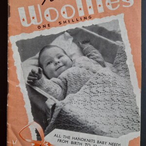 May include: A vintage book cover for "First Year Woollies" featuring a baby in a knitted outfit and blanket. The cover is peach with black and white text and illustrations. The book is "Weldons Practical Knitting Book 360".