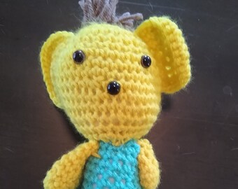 Yellow and blue crocheted stuffed animal