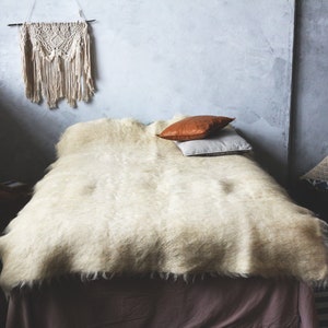 White wool blanket, weighted blanket.