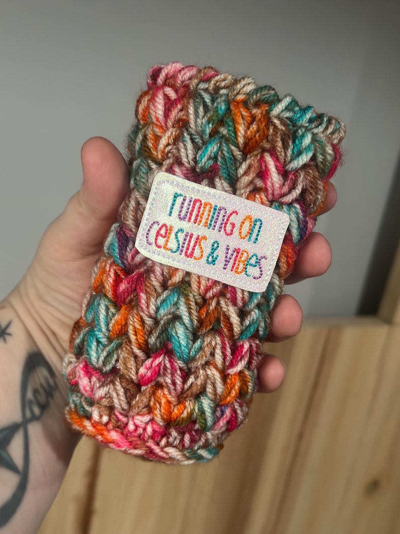 Crochet Skinny Can Cozy with “running on celcius & vibes” Patch image 1