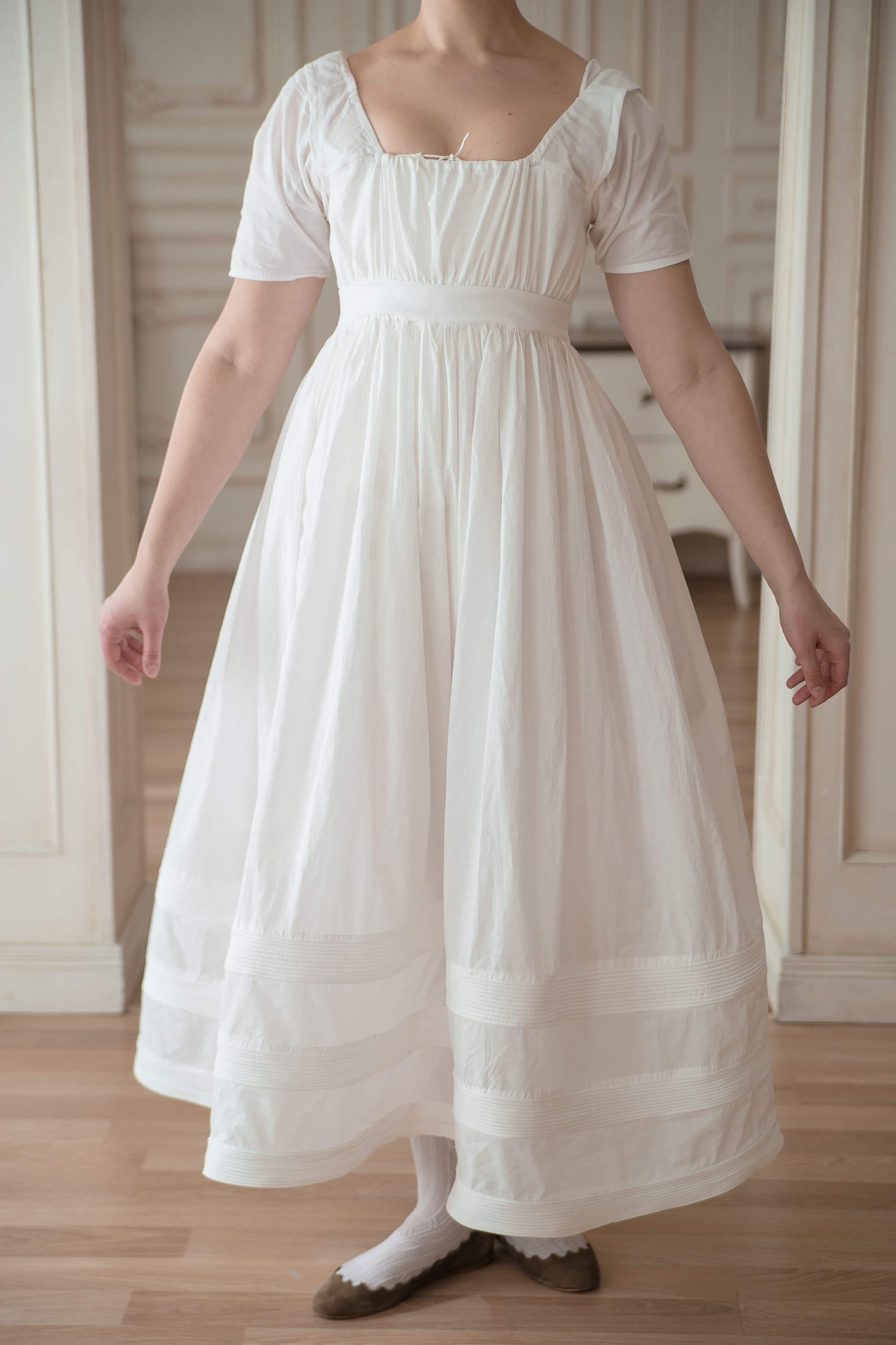 skirt of jane's dress to see the white petticoats pocking Cotton Petticoat: Ruffle Hem Lace Midi two layers of fluffy tulle.Made in China. Beautiful petticoat made by Vicky