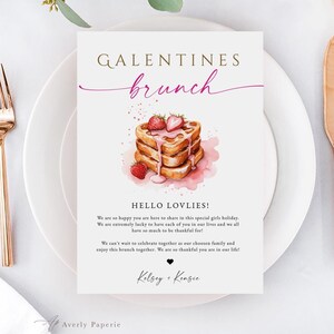 May include: A white card with the words "GALENTINES brunch" in gold and pink script. The card features a watercolor illustration of pancakes with strawberries and syrup. Text below reads "HELLO LOVLIES!" and a message about a brunch gathering.
