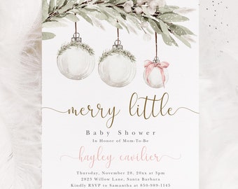 May include: A rectangular baby shower invitation card featuring a watercolor illustration of green pine branches and three hanging white ornaments, one with a pink bow. The text reads merry little Baby Shower In Honor of Mom-To-Be hayley cavilier Thursday, November 28, 20xx at 3pm 2825 Willow Lane, Santa Barbara Kindly RSVP to Samantha at 850-989-1145 Hayley is registered at Target and Pottery Barn.