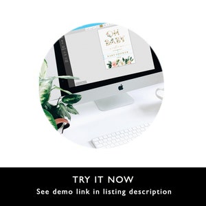 May include: A computer screen displaying a baby shower invitation with the text "Oh Baby" in gold letters and floral accents. The invitation is on a white background with a light blue border.