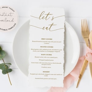 May include: A white menu card with the words "let's eat" in gold script. The menu lists a first course, second course, main course, and dessert. A white plate, gold utensils, and a pink ribbon are also in the image.