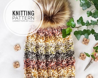 May include: Knitting pattern for a colorful striped beanie with a faux fur pom pom. The pattern is called "Carrottops by Lulu".