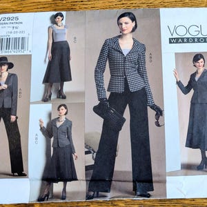 May include: Vogue Wardrobe sewing pattern V2925 for sizes 18-20-22. The envelope features illustrations of a blazer, skirt, and trousers in black, white, and grey. The designs include a checkered jacket, a solid skirt, and wide-leg pants.