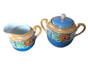 Zestaw do śmietanki i cukierniczki, ręcznie malowany, wykonany w Japonii, ceramiczny, niebiesko-pomarańczowy, kwiatowy wzór