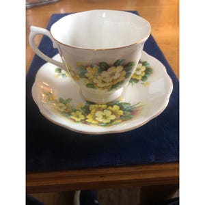 Royal Albert Bone China England Yellow Primrose Teacup & Saucer Set Gold Trim Vintage