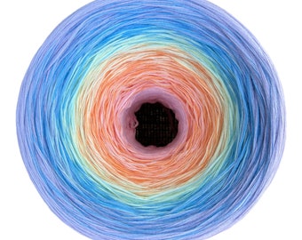 May include: A ball of yarn with a rainbow ombre color pattern, starting with a light pink center and transitioning to light blue on the outside.