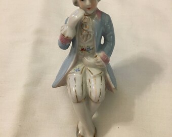 Vintage shelf sitting porcelain figurine made in Japan.