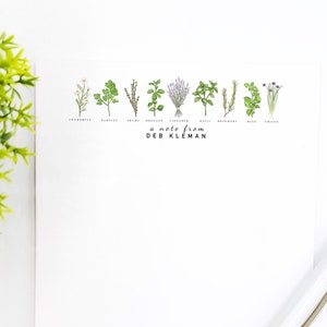 May include: A white notepad with a line of illustrated herbs and the text "a note from DEB KLEMAN".