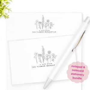 May include: A notepad and notecard stationery bundle with a floral design. The notepad and notecards feature a black and white illustration of a bouquet of flowers with the text "a note from THE FLOWER MERCANTILE".