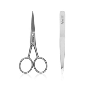 May include: A set of silver grooming tools, including a pair of small scissors and tweezers. The scissors have a silver finish and the tweezers have the text "ArteStile Made in Italy" on the side.