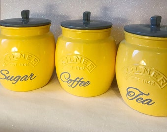 grey and yellow tea coffee sugar canisters