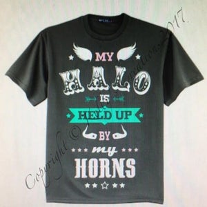 May include: A dark gray t-shirt with a white graphic that says "My Halo Is Held Up By My Horns". The graphic features white wings, stars, and an arrow.