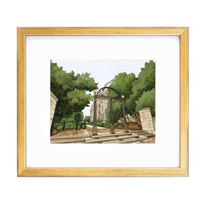 May include: A framed watercolor painting of a brick archway with a stone building in the background. The archway is surrounded by green trees and a brick walkway leads up to it.