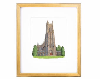 May include: A framed illustration of a tall, stone church with a pointed spire. The church is surrounded by green trees and grass. The frame is gold.