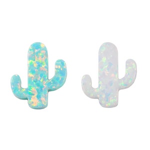 May include: Two opal cactus charms, one in a light blue color and one in a white color. Both charms have a sparkly iridescent finish.