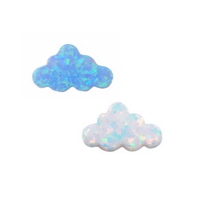 May include: Two iridescent opal cloud shaped cabochons. One is light blue and the other is white.