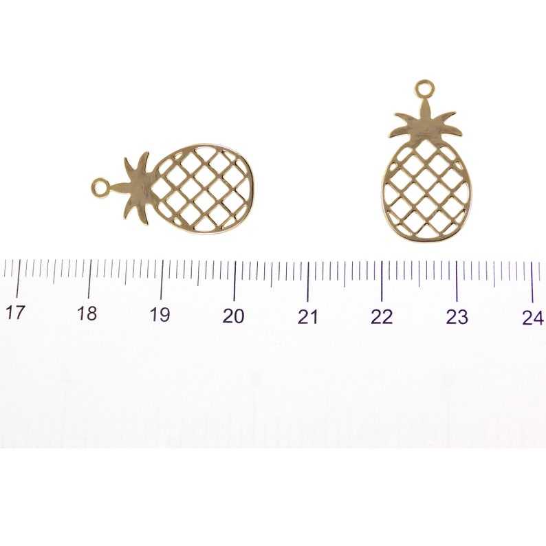 Gold pineapple charm 22.8 mm shown with size reference for scale