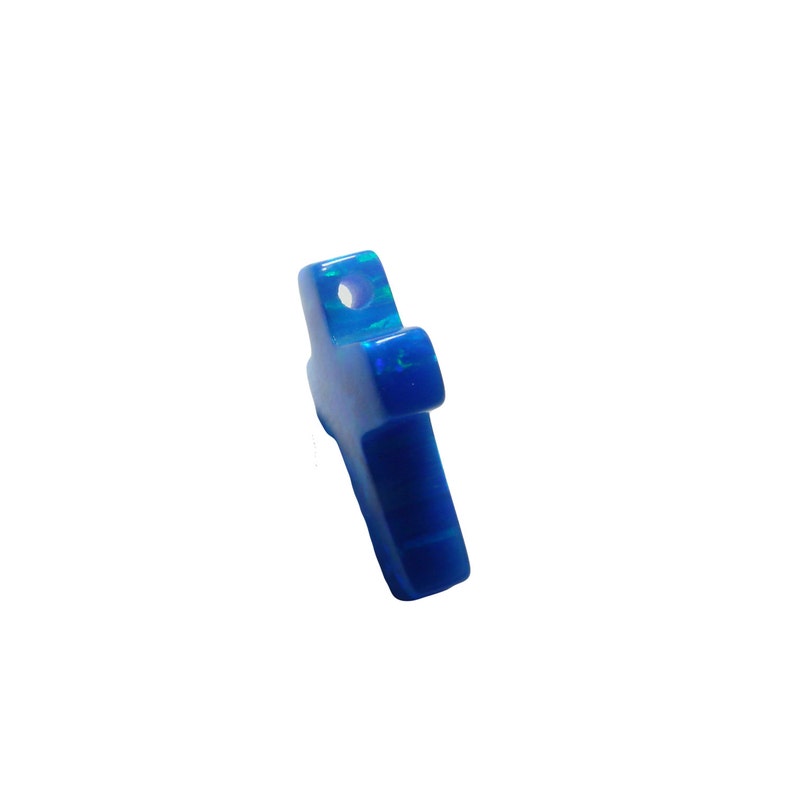 Close‑up of blue opal cross charm with side hole for DIY jewelry