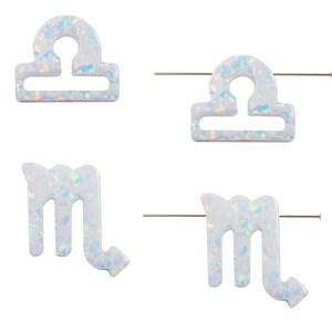 Lab‑created opal zodiac pendant with top hole for astrology jewelry making.