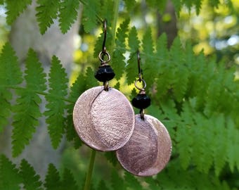 Handmade etched copper earrings.