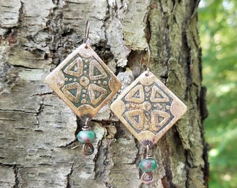 Handmade etched copper earrings.