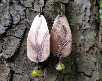 Handmade etched copper earrings.