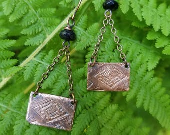 Handmade etched copper earrings.