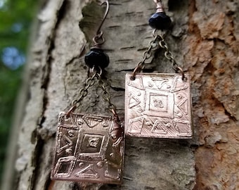 Handmade etched copper earrings.