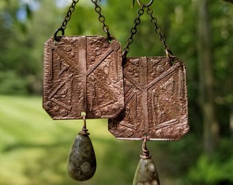 Handmade etched copper earrings.