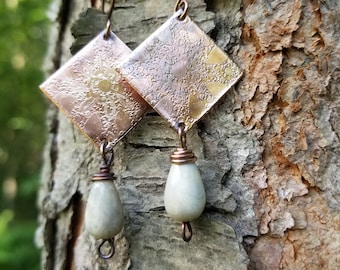 Handmade etched copper earrings.