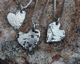 Sterling silver 'HEARTS ON FIRE' necklace.