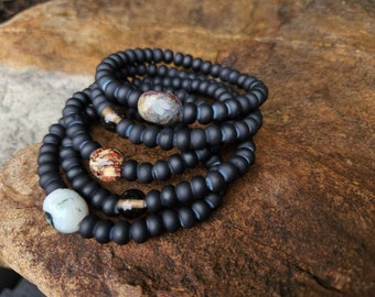 Rondelle black glass with glass or stone accent bracelet.