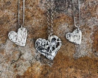 Sterling silver 'HEARTS ON FIRE' necklace.