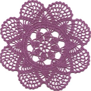May include: A handcrafted, purple crochet doily with a floral design. The doily features a central floral motif surrounded by concentric rings and a scalloped edge. The openwork design allows the white background to show through.