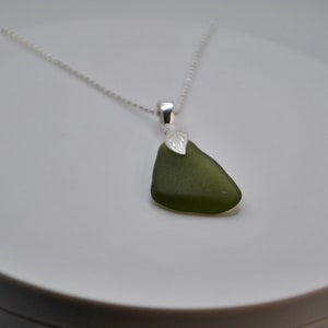 Sea Glass Pendant Necklace. Dainty silver chain with dark green sea glass pendant.