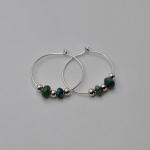 Classic, lightweight, sterling silver hoops with turquoise beads.  Great everyday earrings.