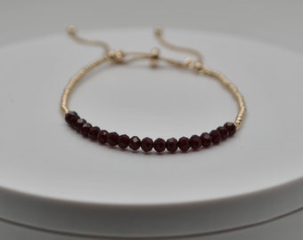 Gold Stretch Bracelet, Stackable Bracelet, Gold Beaded Bracelet, dark burgundy gemstone