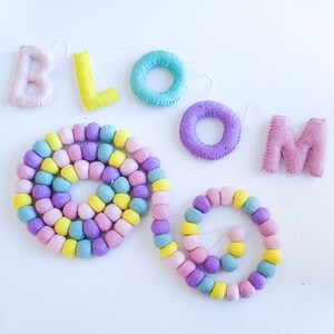 Wool felt letter garlands are an easy way to add a little color and whimsy to your birthday party, play room, or any other room in your home. Party, celebration, home decor, nursery, spring